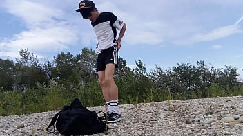 Ultra-cute lad Jon Arteen wears dark-hued Adidas outfit, demonstrates his underwear, walks freeballing, draining off throught his short shorts, jizzing outdoor